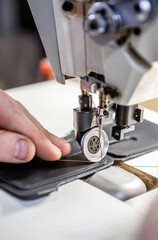 Close up of professional sewing machine for leather work.