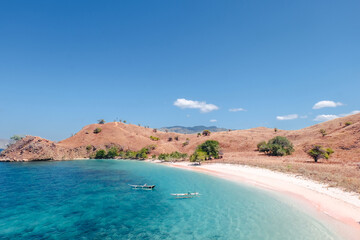 wooden boat on pink beach Lombok Indonesia. Beautiful scenery of pink beach