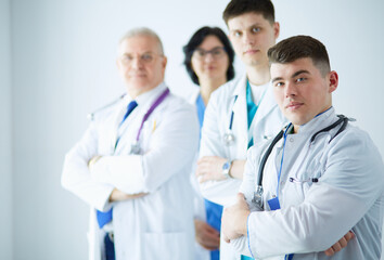 Fototapeta premium Successful medical team. Confident doctors team standing together and smiling