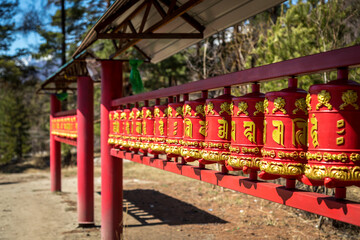 ritual red buddhist spinning drums