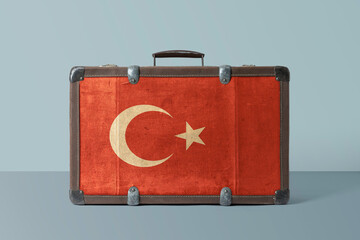Turkey flag on old vintage leather suitcase with national concept. Retro brown luggage with copy...