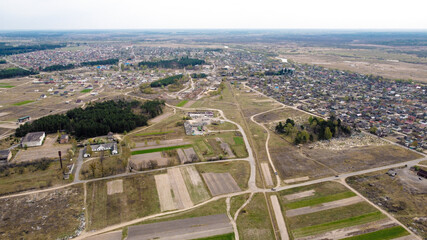View from the drone on the village and the cemetery, in the background the horizon. Sunny spring day. Ukraine, Europe