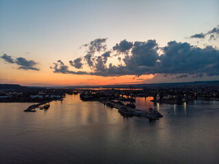 Drone View of the Sea and the Varna Sea Port at sunset time with dramatic sky