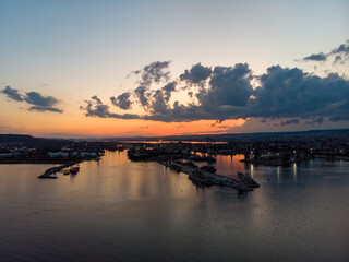 Fototapeta na wymiar Drone View of the Sea and the Varna Sea Port at sunset time with dramatic sky