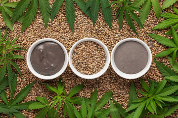 Homemade face mask made of clay with cannabis seeds. Cosmetik or SPA concept. Top view. Flat lay