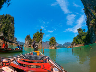 Boating between rock formations in Khao Sok Lake
