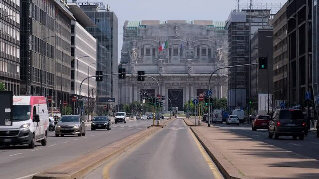 Milan, Lombardy / Italy - May, 28th 2020: Milan Central Station main road with people cycling. Back to life after Coronavirus lockdown.