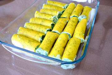 Homemade preparation of typical Italian cannelloni with ricotta and spinach.