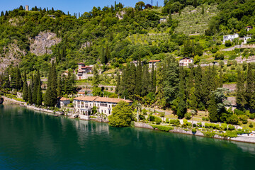 Fototapeta na wymiar Aerial view of the village of Varenna and Villa Monastero on Lake Como, Italy