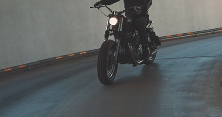 Biker riding on motorcycle in parking lot