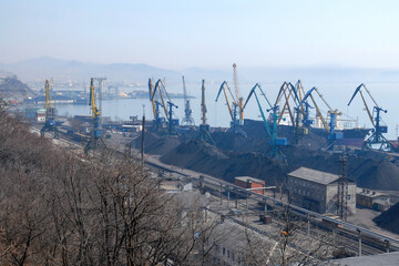 Fototapeta na wymiar Industrial cityscape. View at Nakhodka sea port. Peter the Great Gulf, Sea of Japan, Primorsky Krai (Primorye), Far East, Russia.