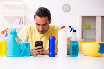 Young male contractor doing housework at home