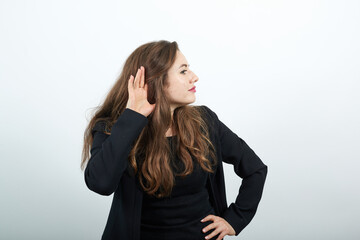 Young Attractive Woman Brunette In In A Black T-Shirt And Sweater On White Background, Interested,...