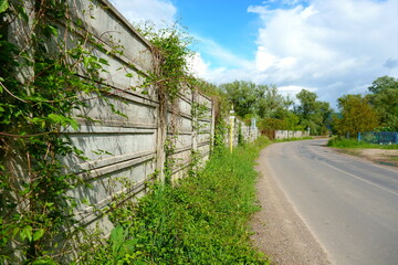 Concrete fence next to the road