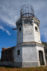 Fototapeta na wymiar Old abandoned lighthouse on Tumanniy cape. Askold island, Primorsky Krai, Russia.