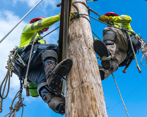 Lineman Asending Utility Pole