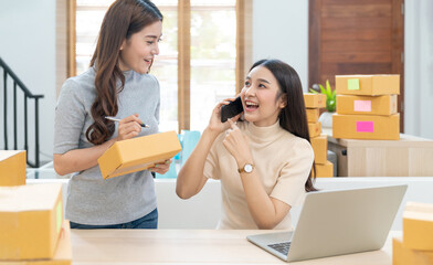 Young asian women happy after new order from customer. Surprise and shock face of asian woman success on making big sale of his online store. Online Selling. Online Shopping
