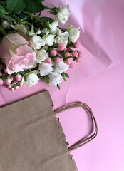 delivery service packing bag flovers pink white background gift shipping