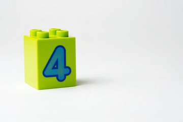 the number four written on the block from the children's constructor