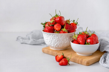 Heap of fresh strawberries in ceramic bowl