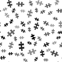 Black Piece of puzzle icon isolated seamless pattern on white background. Business, marketing, finance, layout, infographics, internet concept. Vector Illustration.