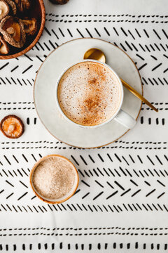 Top View Of Cappuccino Coffee With Shiitake Mushroom Powder. Immune And Healthcare Drink.