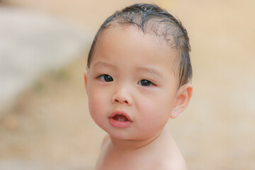 Adorable black haired asian kid