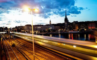 Fototapeta na wymiar fast railway in Stockholm city at dusk
