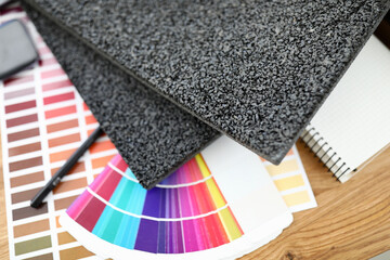 On table are carpet samples bright color palette