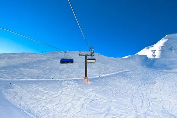 Fotobehang Ski chair lift in the Alps ski resort. © Olena_Fomina