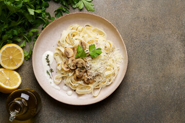 Tagliatelle spaghetti with creamy mushroom pasta sauce. Italian pasta in plate