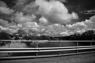 Bridge over the river, black and white photo.