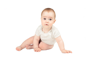 Happy child is sitting on floor isolated on white background