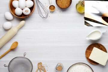 White baking background. Eggs, butter, flour, sugar, salt, milk, olive oil Ingredients and cooking utensils