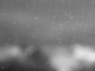 Dirty window glass with blurred background behind