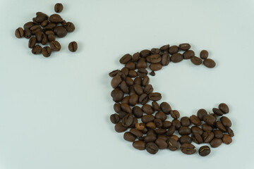 Letter C lined with coffee beans