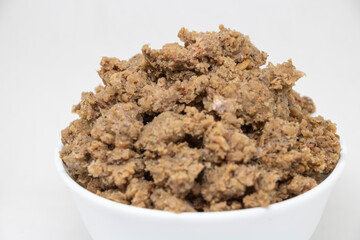 Shrimp paste in a white cup on a white background