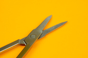 Scissors on an orange background