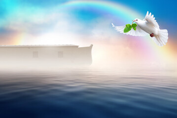 White dove flying with olive branch in its beak. Noah's ark bible story theme concept.