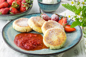 Cheesecakes with berry and sour cream. Yummy dessert