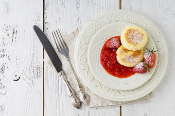 Cottage cheese pancakes, syrniki, curd fritters with berries