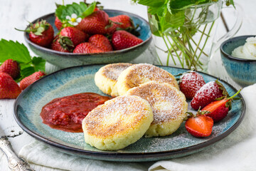 Cheesecakes with berry and sour cream. Yummy dessert