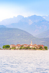 Fototapeta premium Isola dei Pescatori - fisherman island in Maggiore lake with mountains in the background, Borromean Islands (Isole Borromee), Stresa, Piedmont, Northern Italy - travel destination in Europe.