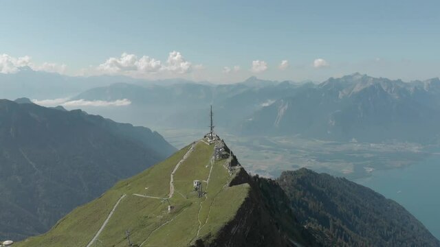 
Aerial shot of Alps mountains. Mountains, peaks, cliffs, rocks, ridges, landscape, green grass, sky, clouds, nature, uncultivated nature, drone video.