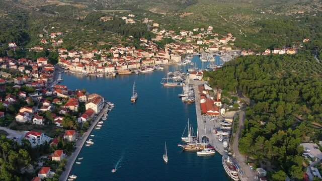 Hvar island, Croatia. Aerial view at the town. Vacation and adventure. Town and sea. Top view from drone at on the houses and blue sea. Travel - video