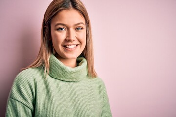 Fototapeta premium Young beautiful blonde woman wearing winter wool sweater over pink isolated background with a happy and cool smile on face. Lucky person.