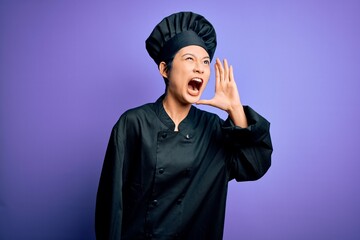 Young beautiful chinese chef woman wearing cooker uniform and hat over purple background shouting and screaming loud to side with hand on mouth. Communication concept.