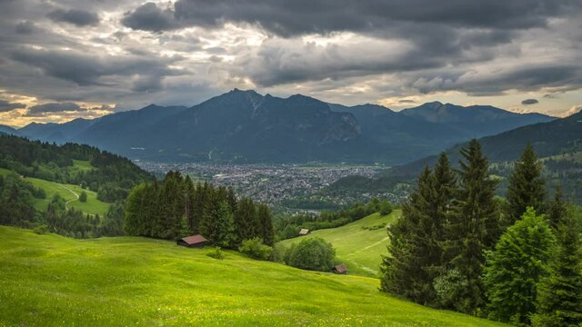 Garmisch partenkichen skyline aerial view of bavarian village nature landscapes alps mountains in backgorund time lapse video.