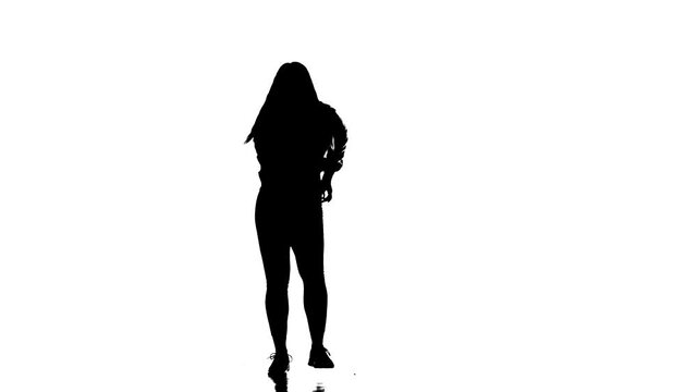 black silhouette on a white background, young sensual beautiful girl dancer with long hair dancing dancehall, hiphop, street modern dance. Contemporary choreography. Long shot