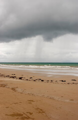 Four mile beach at Port Douglas with heavy storm clouds on the sky